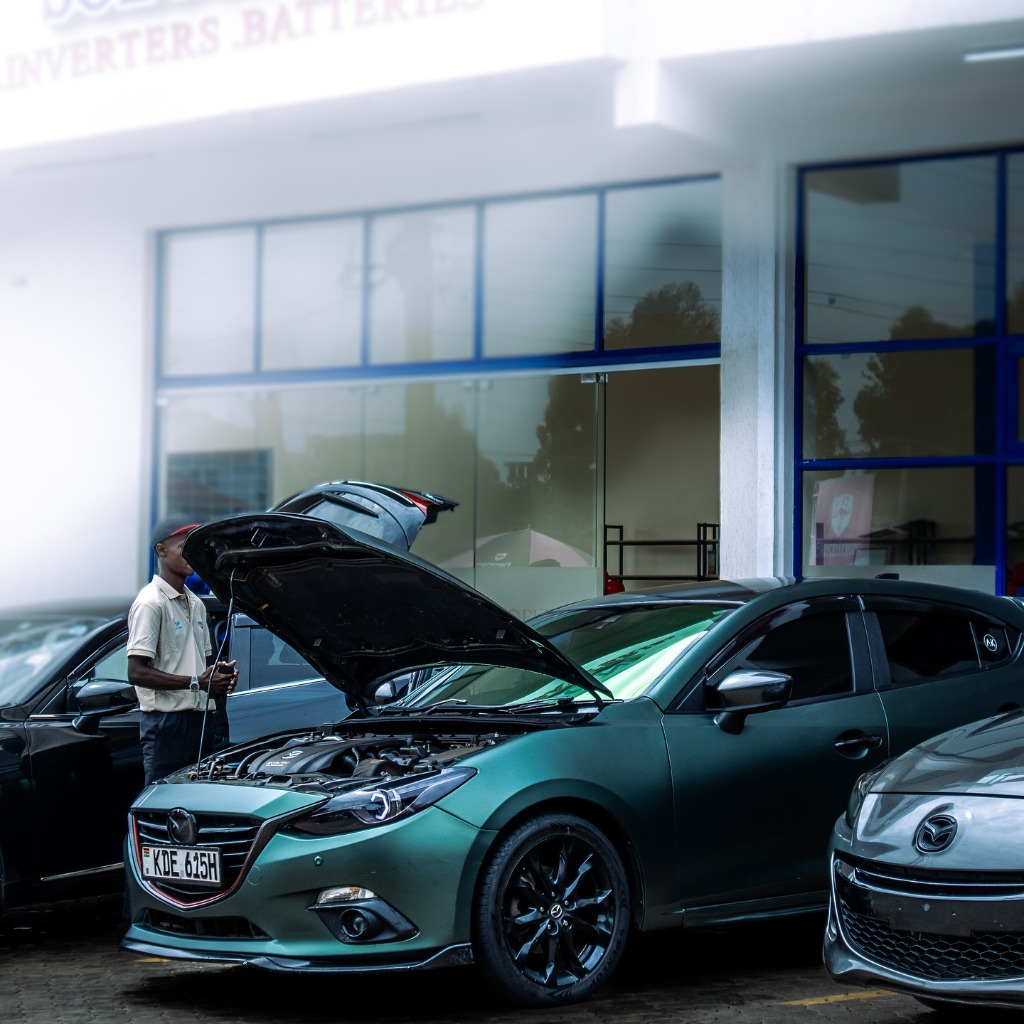 Green Mazda Axela with Open Hood